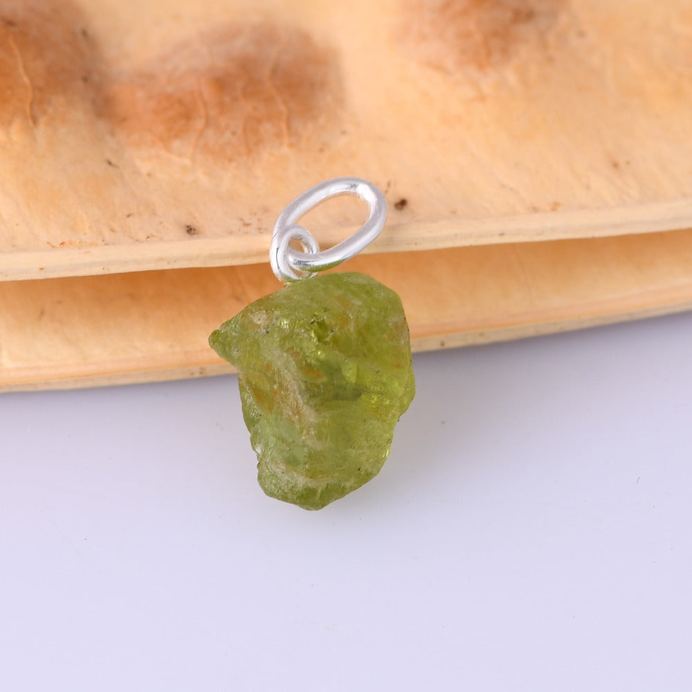 COMPASSION PENDANT SILVER / PERIDOT